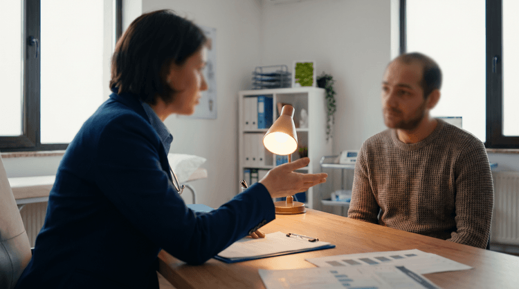 Healthcare professional discussing hCG therapy with male patient
